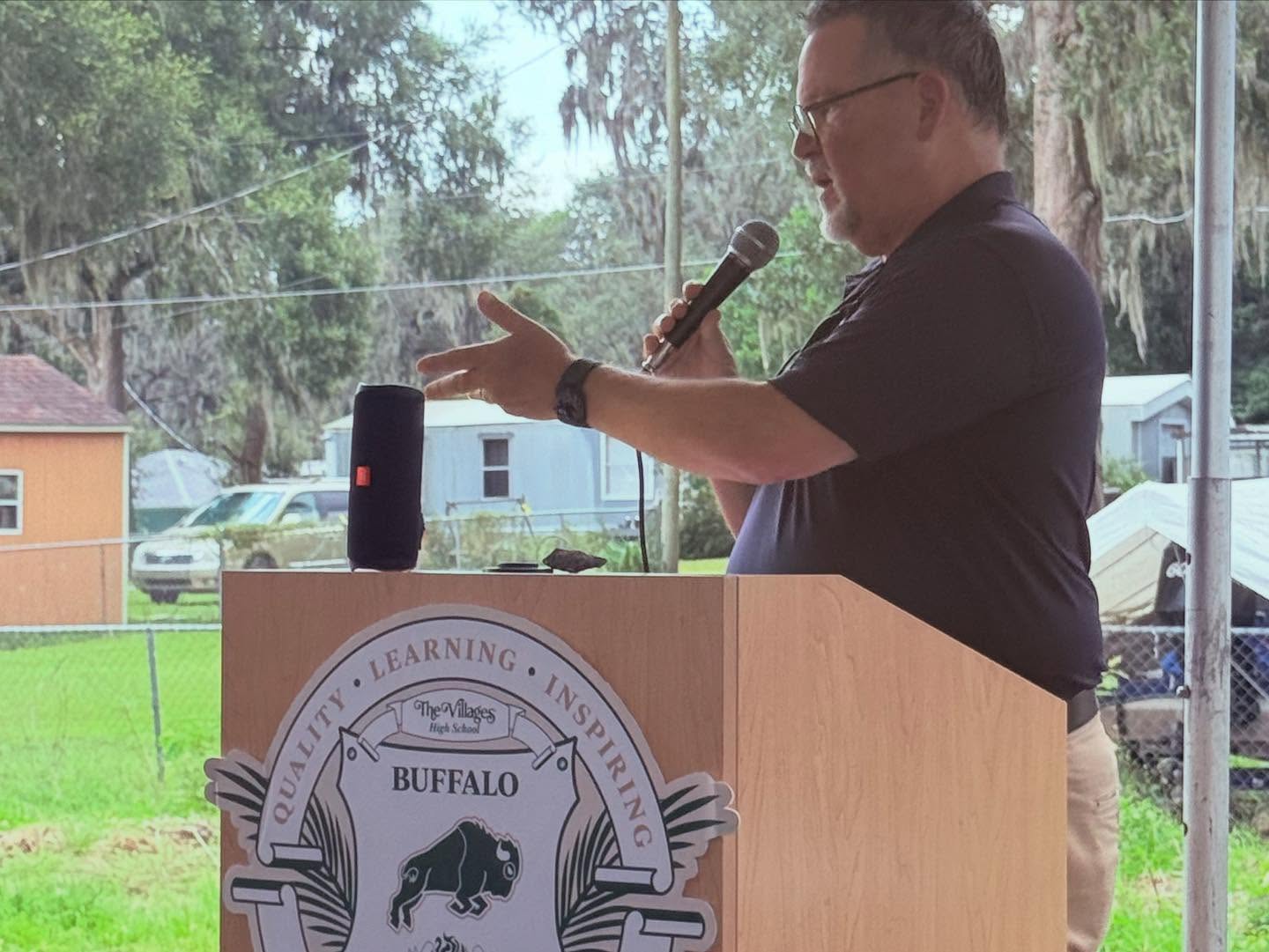 man speaking at a podium