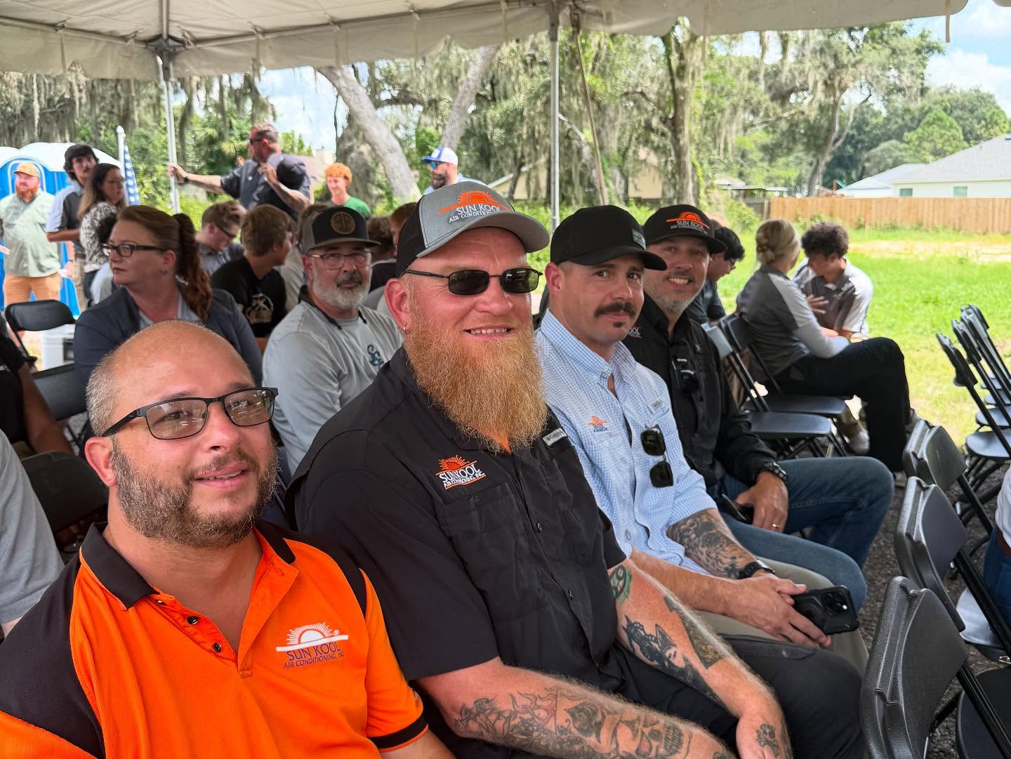 several people sitting in chairs